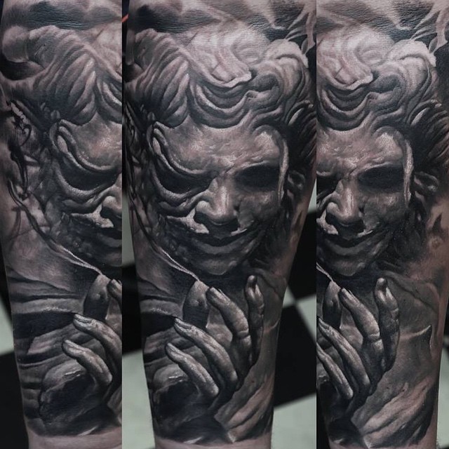 Gray washed style colored arm tattoo of demonic human