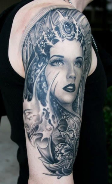 Gray washed style colored shoulder tattoo of woman with various ornaments