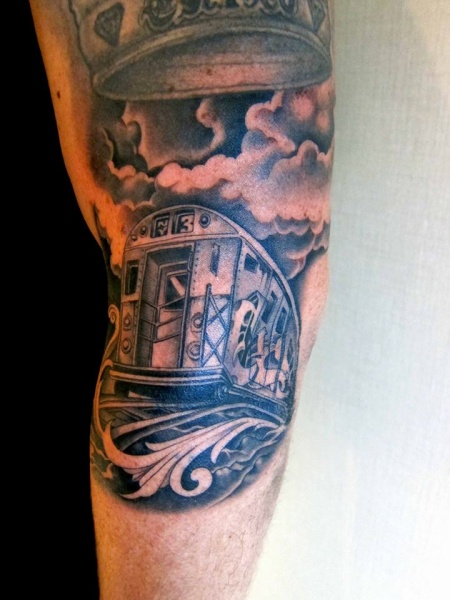 Gray washed style detailed half sleeve tattoo of city train and clouds