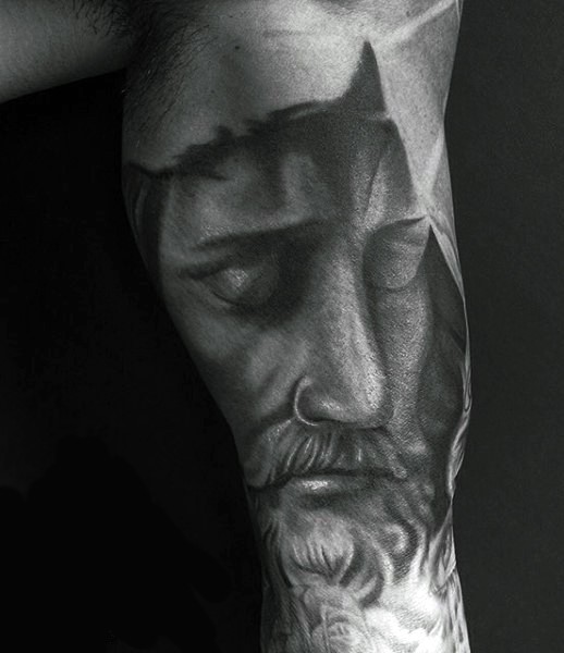 Gray washed style detailed Jesus portrait tattoo on biceps