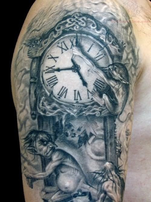 Gray washed style detailed shoulder tattoo of clock stylized with demons