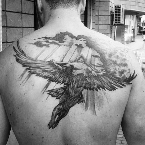 Gray washed style detailed upper back tattoo of flying Icarus