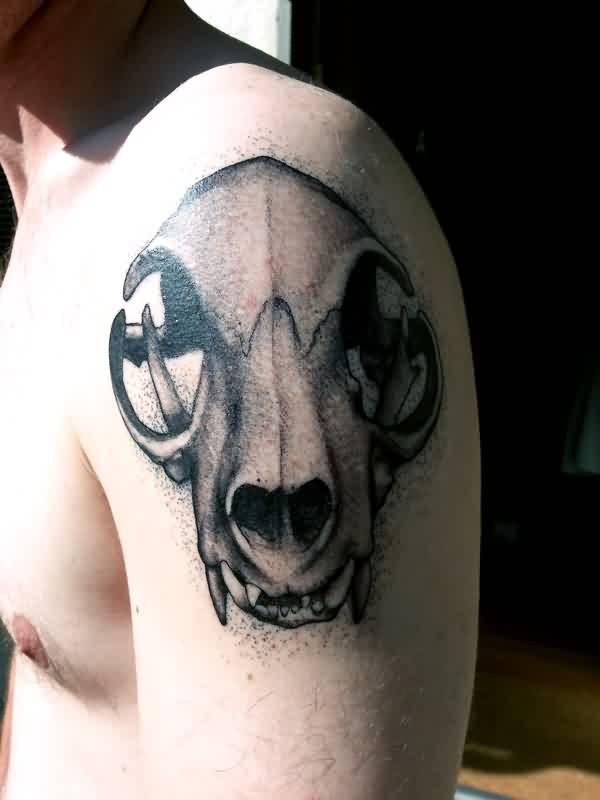 Gray washed style interesting looking shoulder tattoo of animal skull
