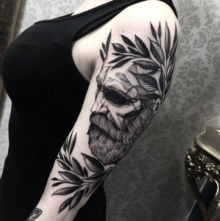Gray washed style large shoulder tattoo of man portrait with leaves