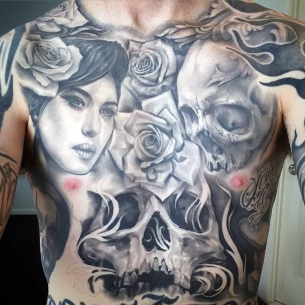 Gray washed style large whole chest tattoo of skulls, woman portrait and rose