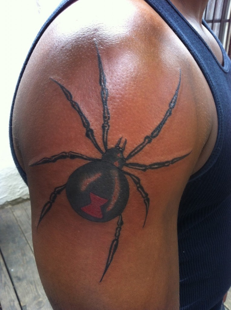 Great black spider tattoo on shoulder