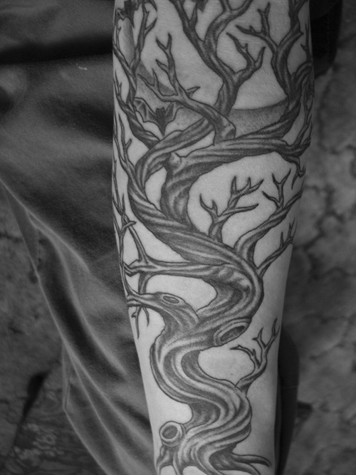 Great black tree tattoo on arm