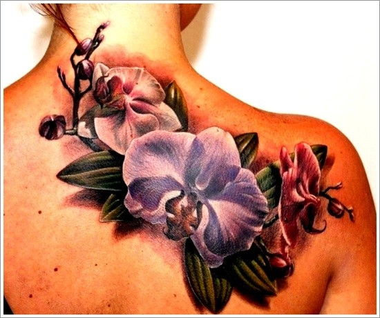 Great colorful orchids tattoo on shoulder blade