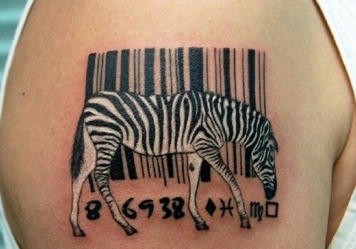 Great combined little black and white zebra with bar code tattoo on shoulder