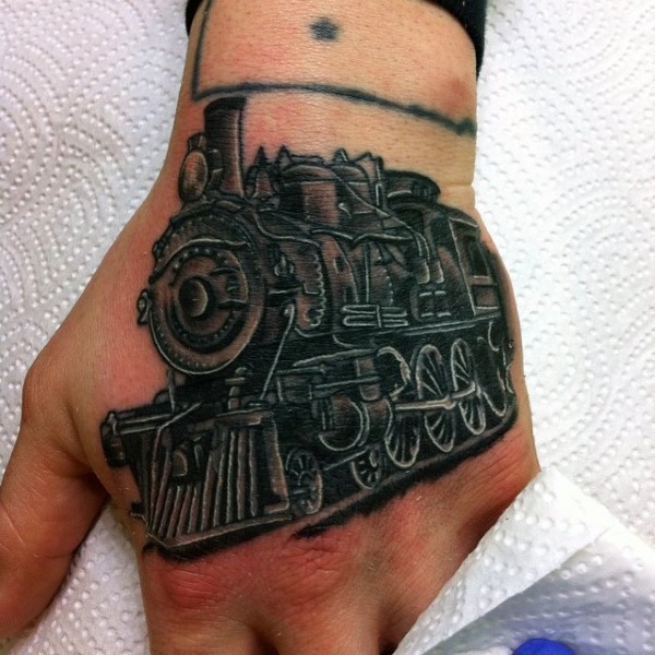Great designed black and white train tattoo on hand