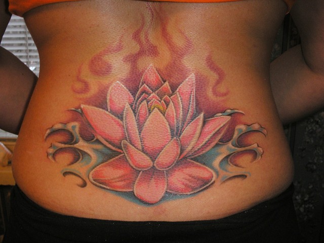 Great lovely red lotus flower tattoo on lower back