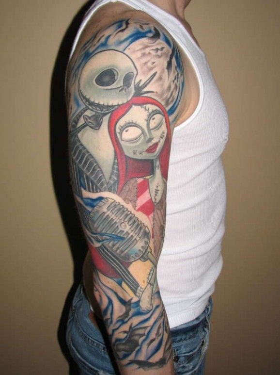 Great musical colored monsters tattoo on sleeve