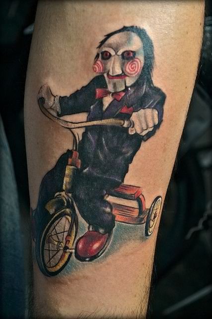 Great painted and colored movie villain on bike tattoo