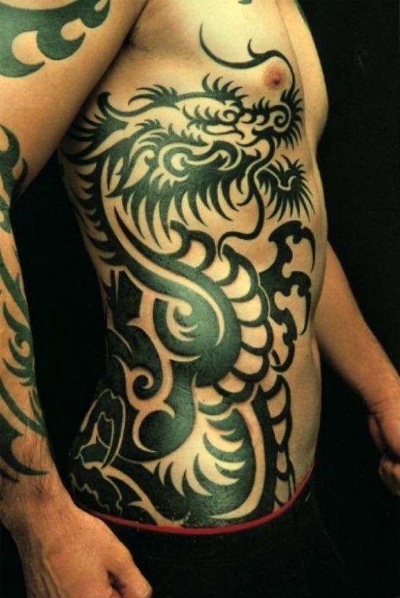 Great tribal black dragon tattoo on ribs