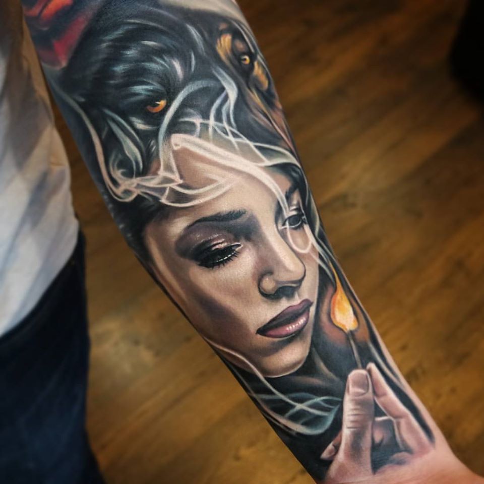 Great woman and match tattoo on forearm
