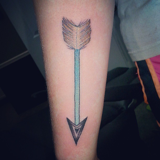 Green arrow tattoo with feather on forearm