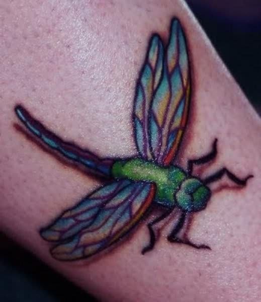Green dragonfly tattoo