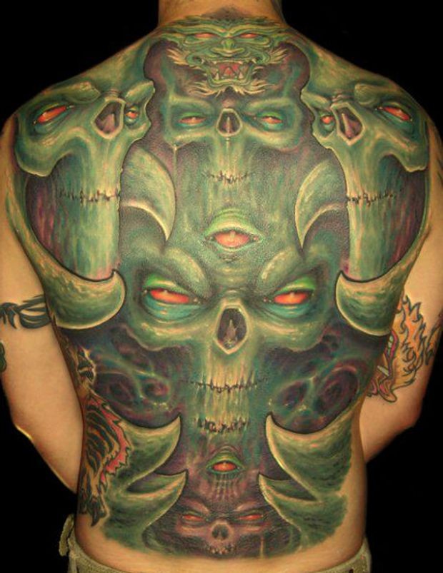Green monsters with red eyes tattoo on whole back