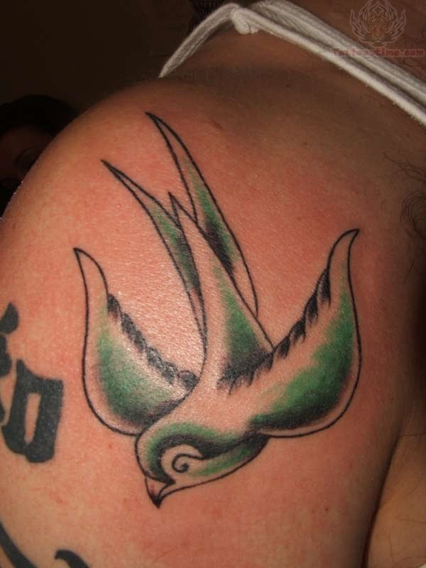 Green swallow bird tattoo on shoulder
