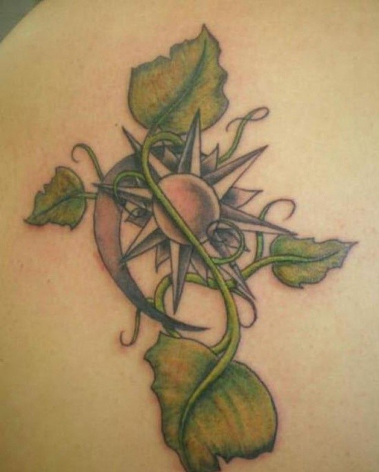 Green vine with sun moon symbols tattoo