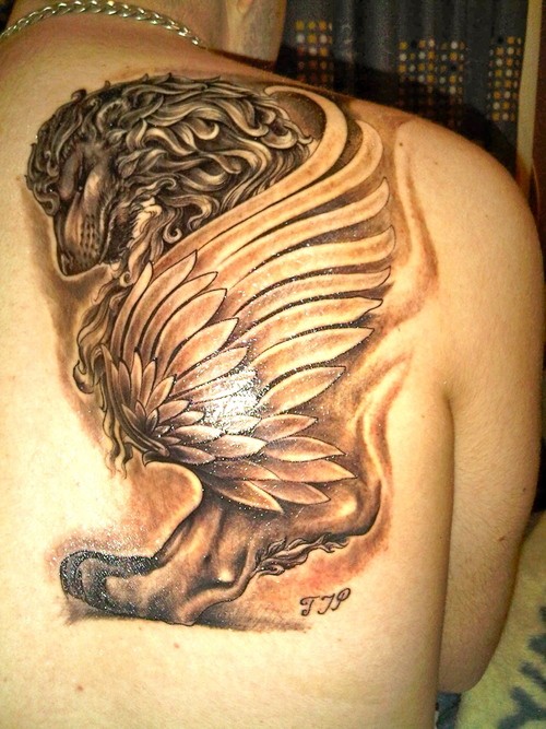 Griffin tattoo with wings on shoulder