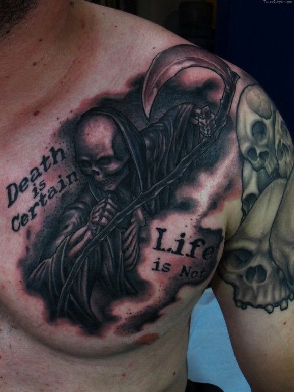 Grim reaper and lettering tattoo on chest by Chris Black