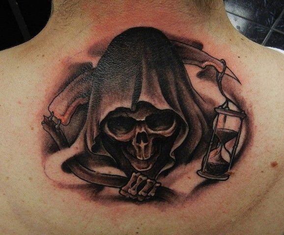 Grim reaper with sand clock tattoo on back by geri