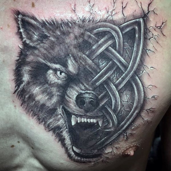 Half Celtic style black ink wolf tattoo on chest