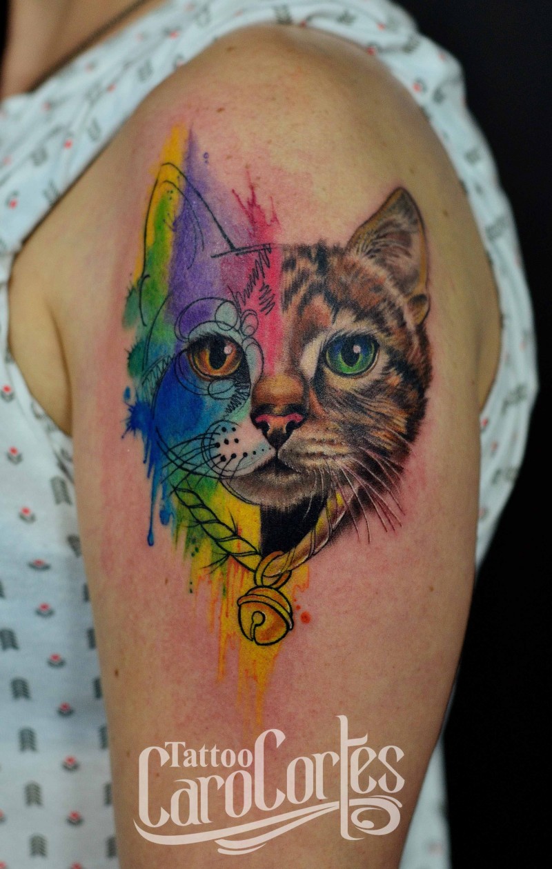 Half realistic half watercolor cat&quots head with bell on collar colored shoulder tattoo by Caro Cortes