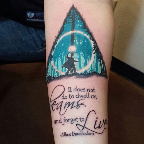 Harry Potter themed colored forearm tattoo with lettering