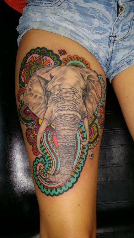 Head of an elephant with patchwork tattoo on thigh for women
