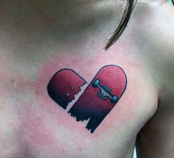 Heart shaped broken red skateboard tattoo on chest