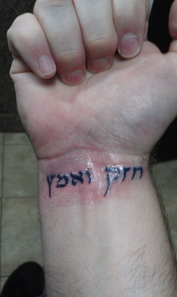 Hebrew lettering tattoo on wrist