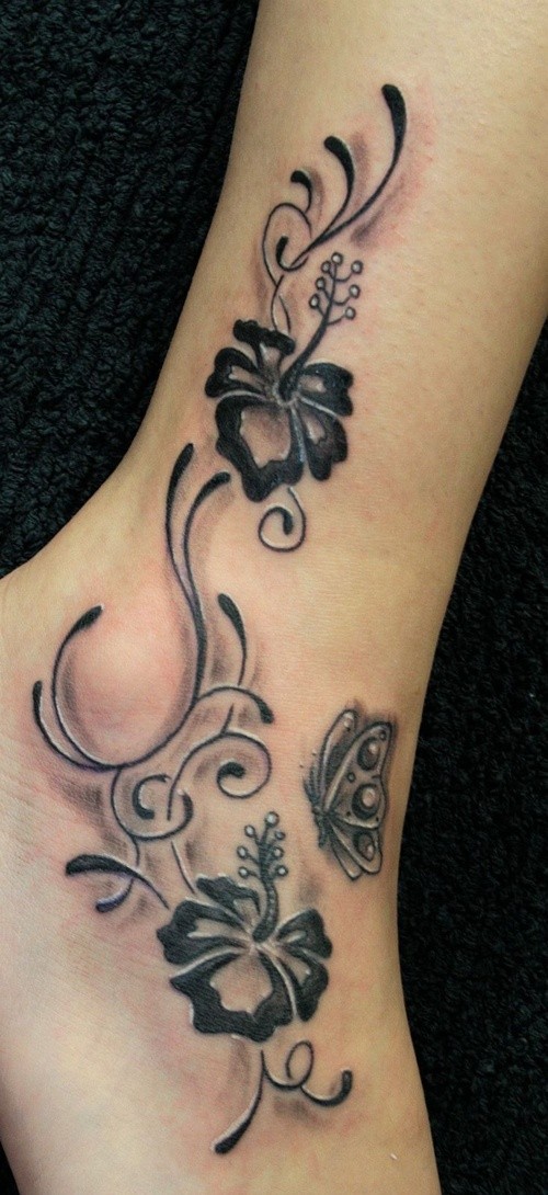 Hibiscus flowers with butterfly tattoo on foot