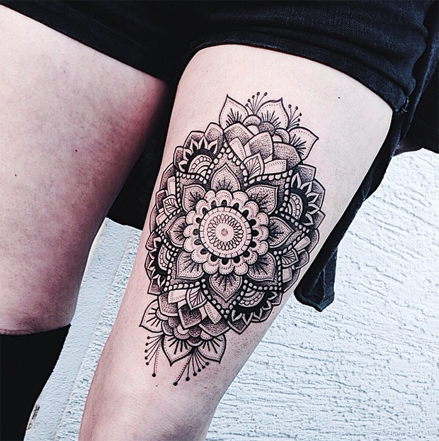 Hinduism style black ink arm tattoo of beautiful flower