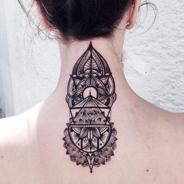 Hinduism style black ink back tattoo of typical ornament