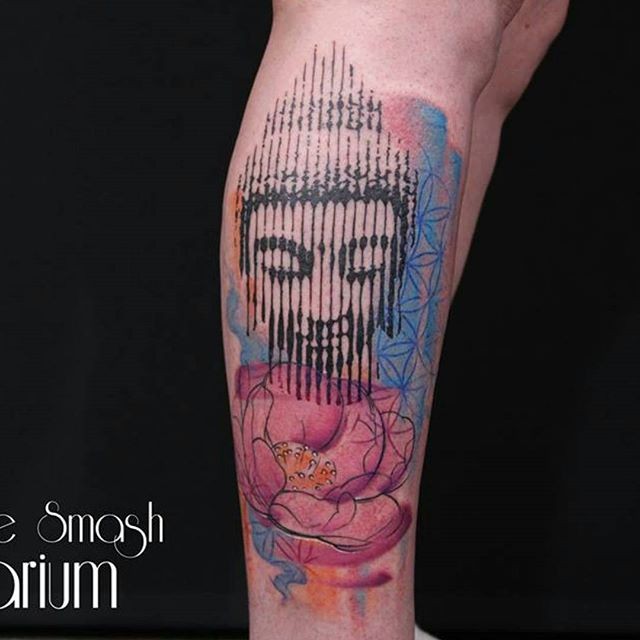 Hinduism style colored leg tattoo of Buddha head with flower
