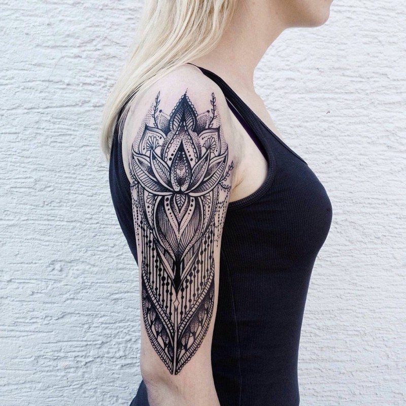 Hinduism style detailed shoulder tattoo of various ornaments