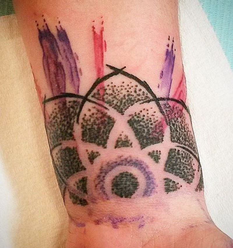 Homemade abstract style watercolor wrist tattoo of ornamental flower