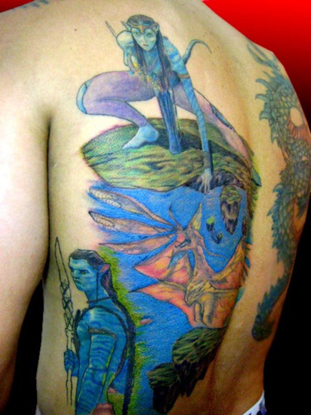 Homemade carelessly painted Avatar themed tattoo on half back