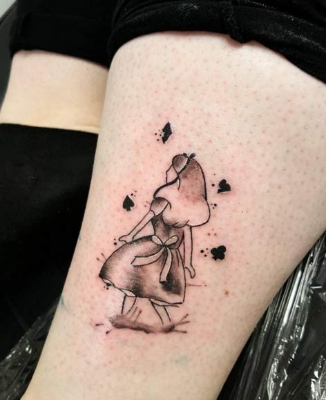 Homemade lie carelessly painted black ink Alice tattoo