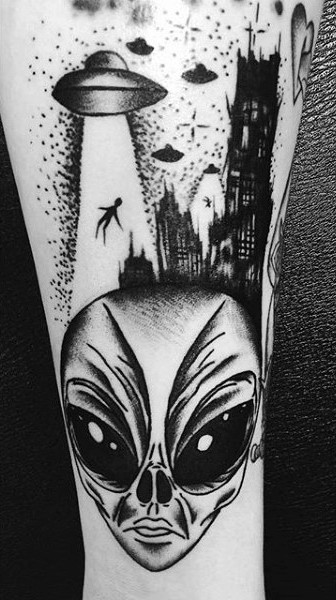 Homemade like black ink alien themed tattoo on leg