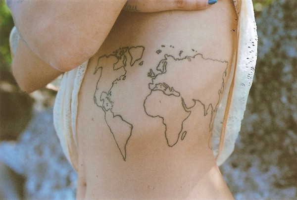 Homemade like black ink usual side tattoo of world map