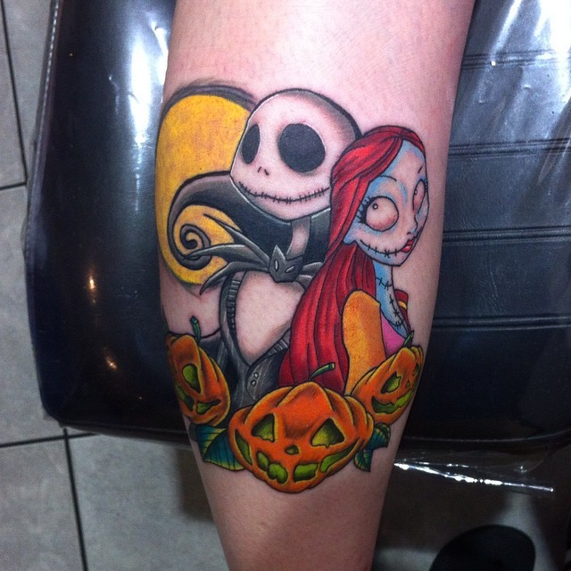 Homemade like colored monster couple tattoo combined with pumpkins