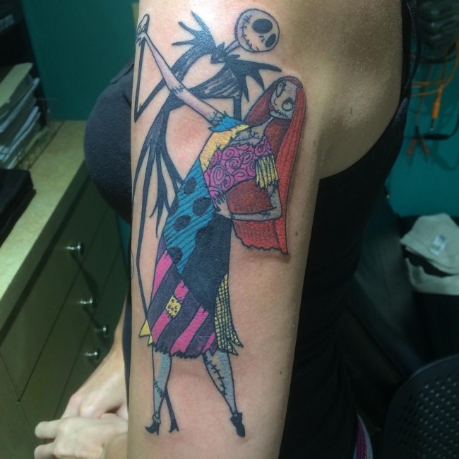 Homemade like colorful shoulder tattoo of romantic monster couple