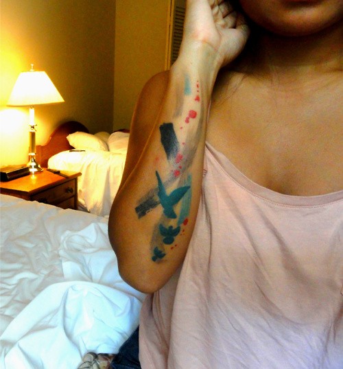 Homemade like little watercolor birds tattoo on arm