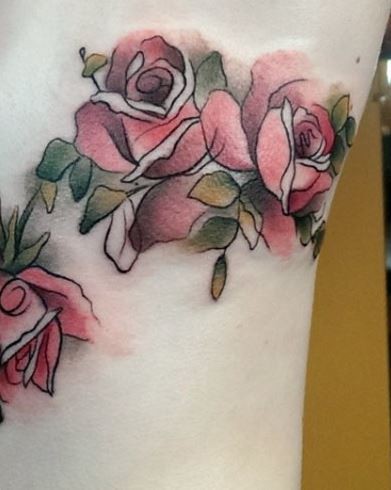 Homemade like multicolored simple tattoo on side of rose flowers