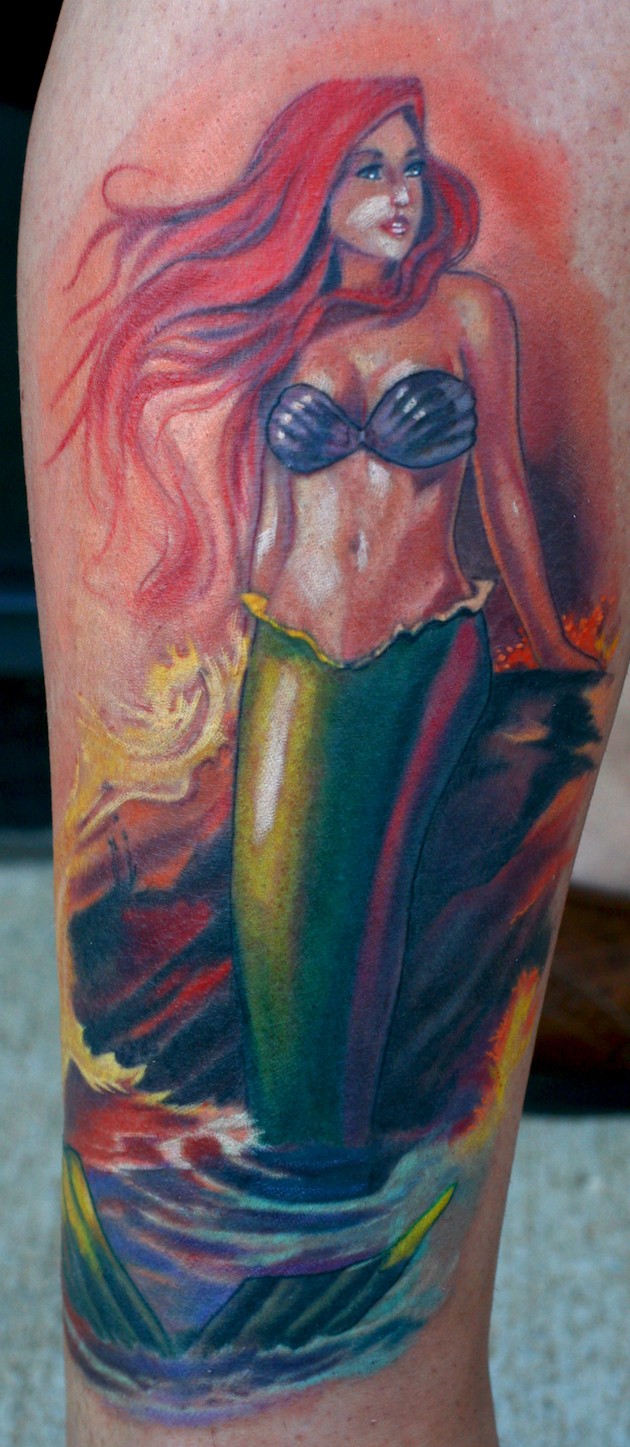 Homemade like natural looking colored leg tattoo of beautiful mermaid