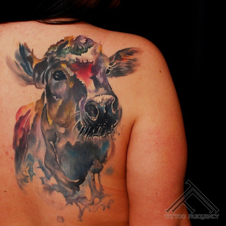 Homemade like watercolor style big cow tattoo on back