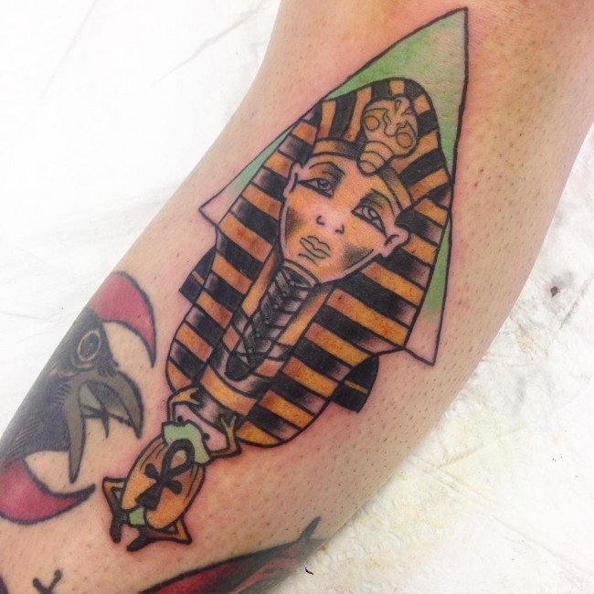 Homemade multicolored ancient Egypt themed pharaoh statue tattoo with Ankh